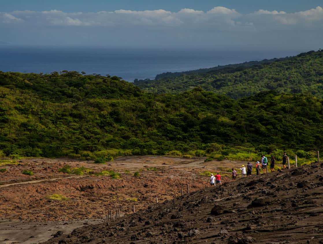 Guests from a small ship cruise hiking on an island in the south pacific. 