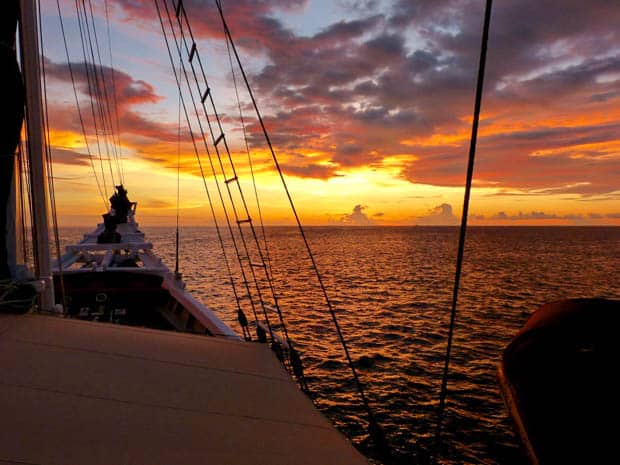 The bow of a small ship going into the sunset while cruising in Indonesia.