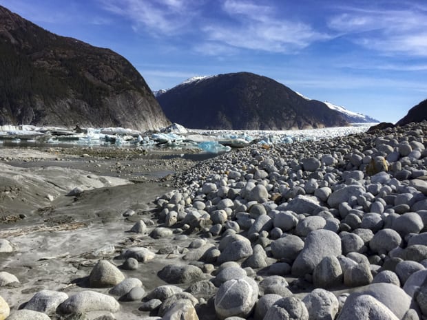 Pebble and mud leading up to the icebergs and glacier near Baird Glacier in Alaska.