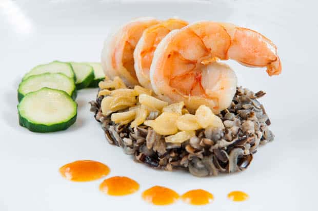 Prawn dish with wild rice and zucchini.