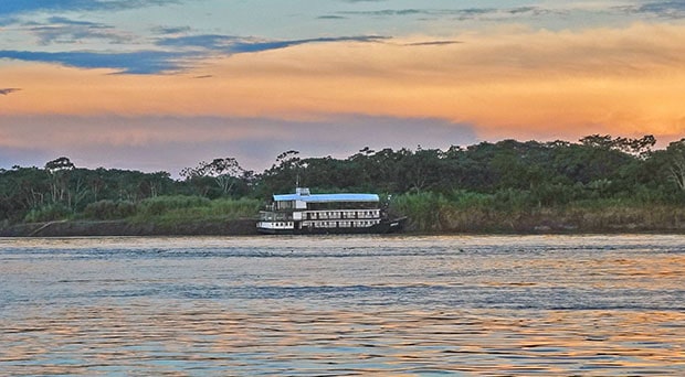 The Amatista river boat docked on the shore of the Peruvian Amazon river.