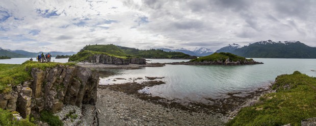 People on a coastal hike with the islands and shoreline of Katmai Alaska.