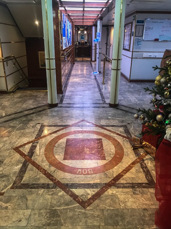 A compass rose created in the granite floor of deck three aboard hebridean sky polar expedition ship