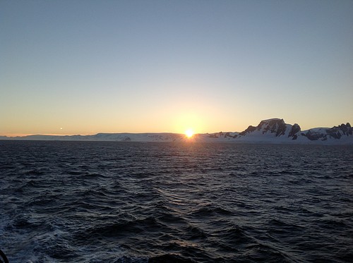 Sunset in Antarctica seen from a small ship cruise.
