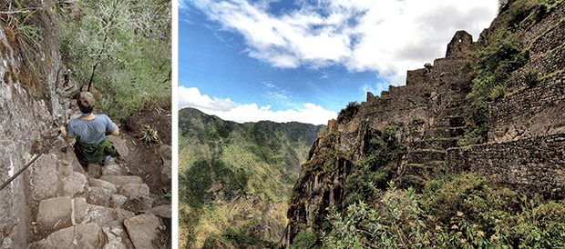 Person walking down the steep steps and holding onto a cable while hiknig Huayna Picchu at Machu Picchu. 
