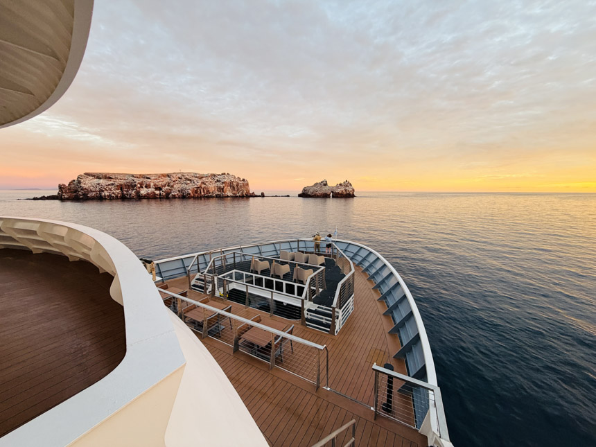 A sunset seen from the bow view of the National Geographic Venture