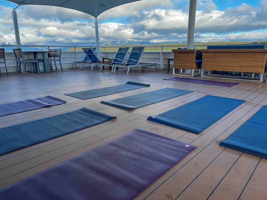 Yoga mats set out on covered outdoor upper deck of Nat Geo Venture in the morning on a Lindblad Alaska cruise.