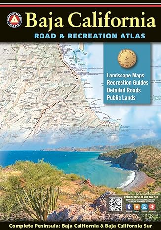 Book cover of Baja Road and Recreation Atlas with tan title text over black background above a sample of a map over a photograph of a blue water cover surrounded by green desert landscape and a green cactus.