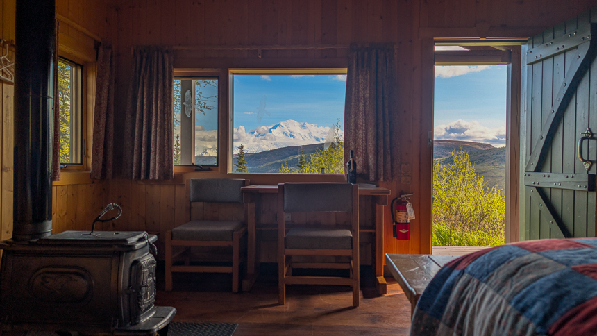 Cabin with a view from inside Camp Denali cabin with views of Denali mountain