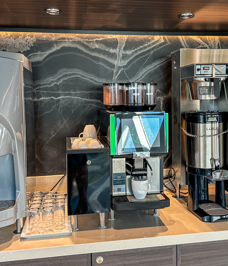 A high-tech espresso machine on a counter aboard Douglas Mawson for guests to enjoy aboard