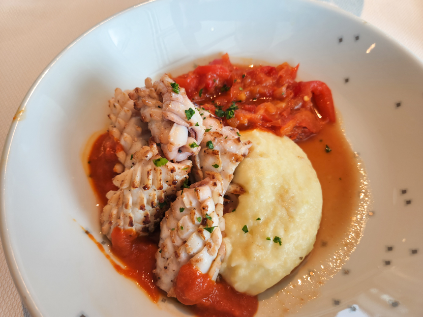 plated food from Nuna restaurant aboard Le Commandant Charcot. Sea food over mashed potatoes and vegetables.
