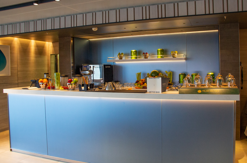 Spa area aboard Charcot ship with Detox Juice Bar with fresh vegetables and fruit displayed and juicing machines.