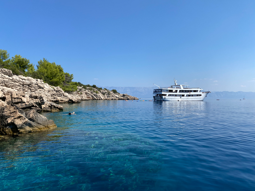 Small cruise ship sailing in the Mediterranean on a bright sunny day off the cost of Croatia 