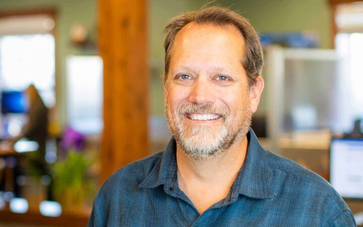 adventuresmith explorations founder and president todd smith smiling standing in an office