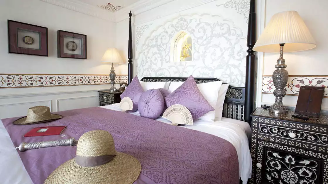 Jahan Suite with queen bed, nightstands and reading lights.