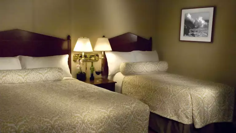 A room in the boutique Baranof Hotel in Juneau, Alaska, with twin beds and comfortable blankets