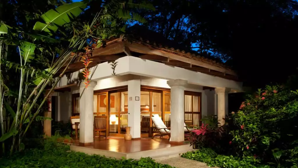 The beachfront Hotel Capitán Suizo at Playa Tamarindo, Costa Rica, is surrounded by large, native trees and lush, colorful gardens.