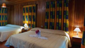 Two king-size beds inside a junior suite at the Hotel Heliconia, a comfortable abode located in Costa Rica's Monteverde region