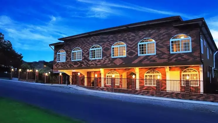 La Casa De La Abuela, lit up at night, is a cozy hotel with 18 rooms in the valley of the Caldera River in Panama