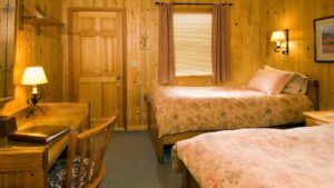 Another look at the room with two twin beds inside the North Face Lodge, a traditional inn located in the Alaskan wilderness within Denali National Park