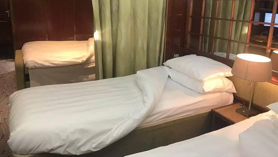 Hebridean Sky with 3 twin beds, nightstand and chair.
