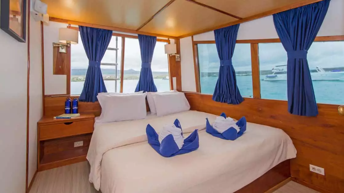 Cabin 7 aboard Beluga with double bed and big windows.