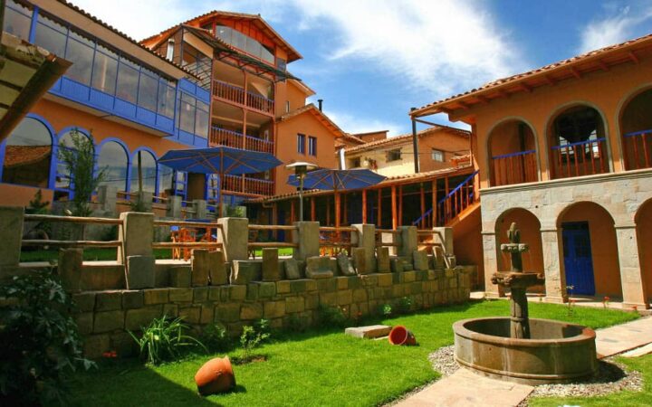 The courtyard with a lawn and a fountain at the Casa Andina Classic Cusco San Blas, located in historic Cusco, Peru, just three blocks off the main plaza.