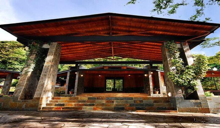 Entryway to lobby area of Casa Grande Bambito, surrounded by green forest in Panama