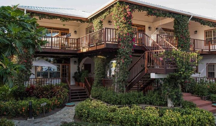 Walkways and balconies surrounded by vibrant local foliage at Chabil Mar Villas in Belize