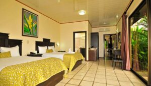 With a bright, clean room, two queen beds, tiled floors, artwork, and a view of the jungle, the Arenal Manoa Lodge in Costa Rica is perfect for naturalists