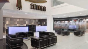 The lobby, with contemporary decor and couches for seating, at Wyndham Costa del Sol hotel, connected to the Lima International Airport