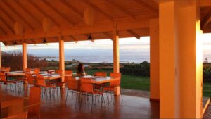 looking out at the ocean from under a covered area at the Altiplanico hotel