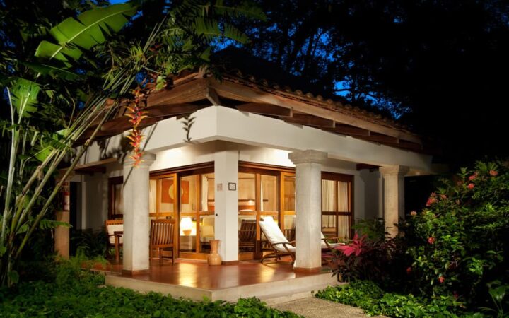 The beachfront Hotel Capitán Suizo at Playa Tamarindo, Costa Rica, is surrounded by large, native trees and lush, colorful gardens.