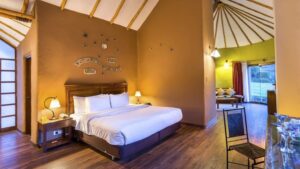 Wooden floors and furnishings add modern luxury to the Matrimonial Suite at Colca Lodge in Peru