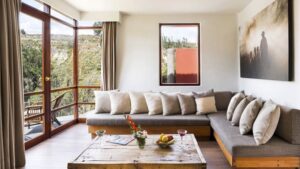 Huge "L" couch with 180-degree views in the Panorama Suite at Colca Lodge in Peru