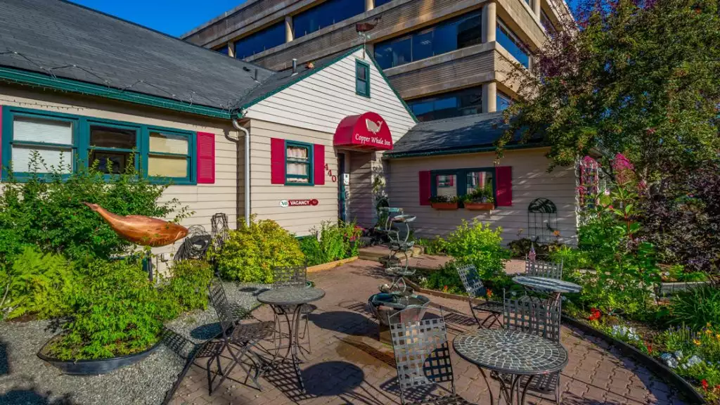 The front of a small hotel, Copper Whale Inn on a sunny day in anchorage Alaska