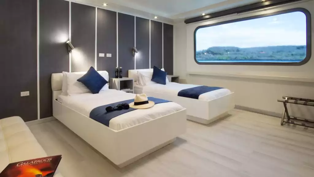 Stateroom with twin beds aboard Galapagos Horizon