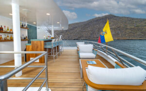 Tables and chairs set up on the Upper Deck of Sea Star Journey luxury yacht in the Galapagos Islands