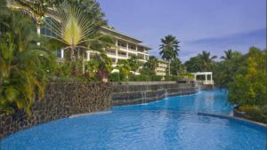 Outdoor pool with local plants and trees surrounding, at Gamboa Rainforest Resort in Panama