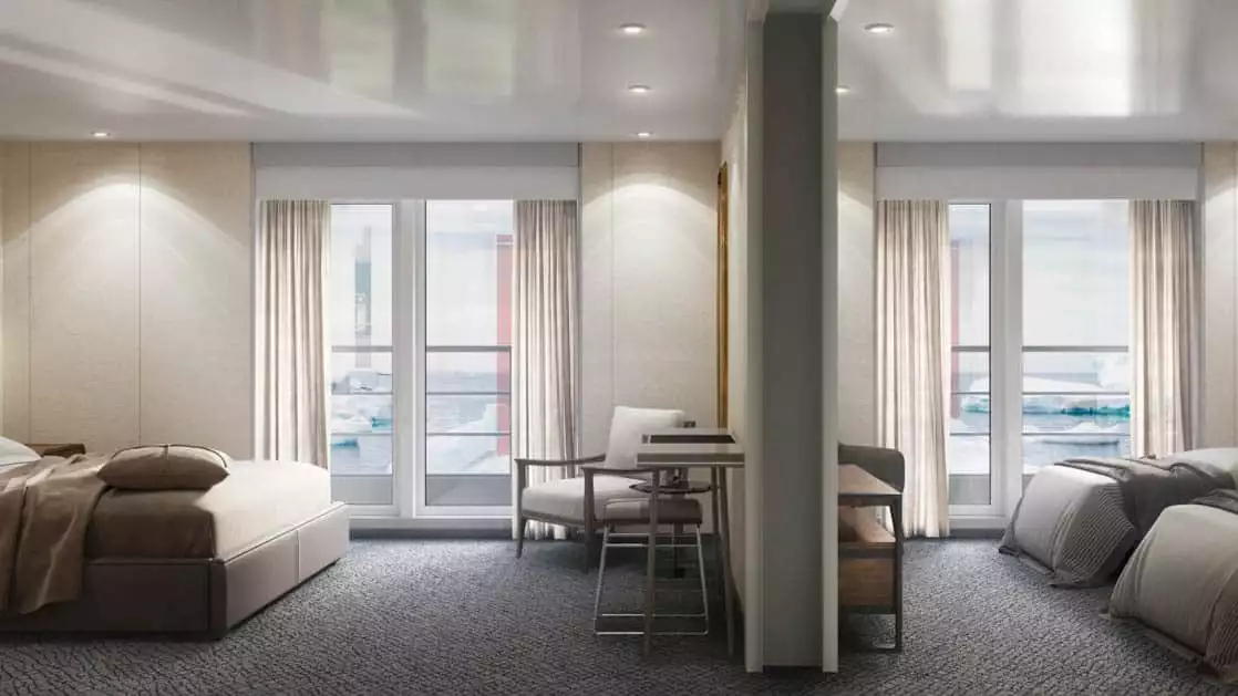 Triple Suite on Magellan Explorer with 2 twin beds & 1 sofa bed, enclosed by partition wall with storage & seating on either side