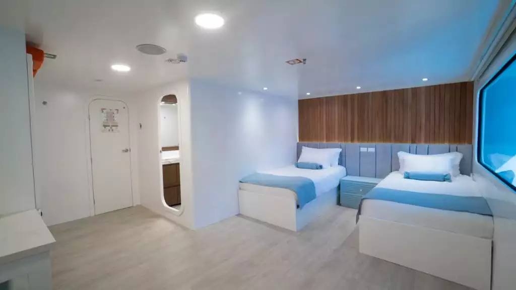 Stateroom with twin beds aboard Ocean Spray