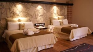 Two double beds inside a standard room at Sonesta Posadas Del Inca in Peru's Sacred Valley, a boutique hotel near Machu Picchu.