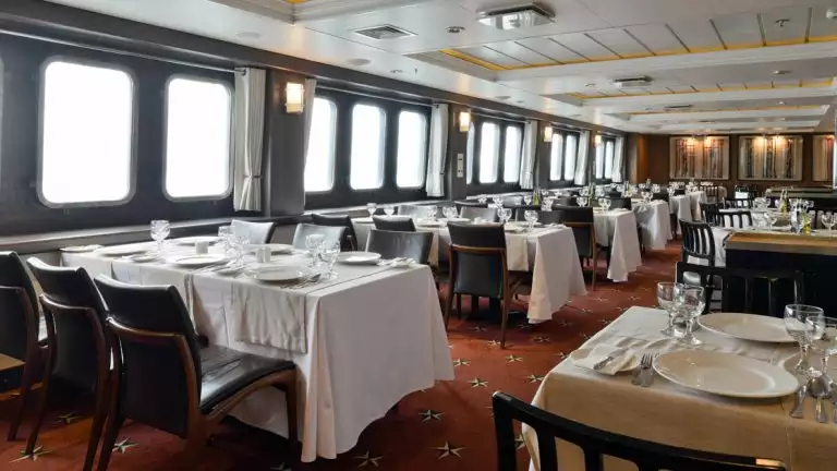 The Stella Australis in Chilean Patagonia features a beautiful dining room with abundant windows to take in Patagonia while you dine