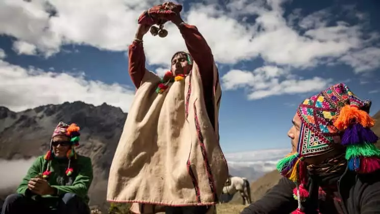 local spiritual leader performing blessing on salkantay trek to machu picchu