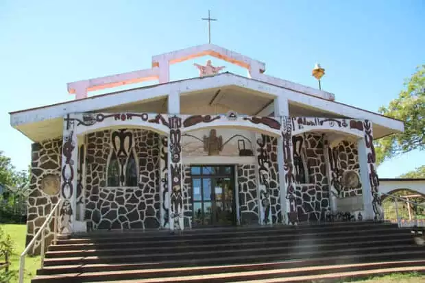 A small church with engraved decorations on the walls.