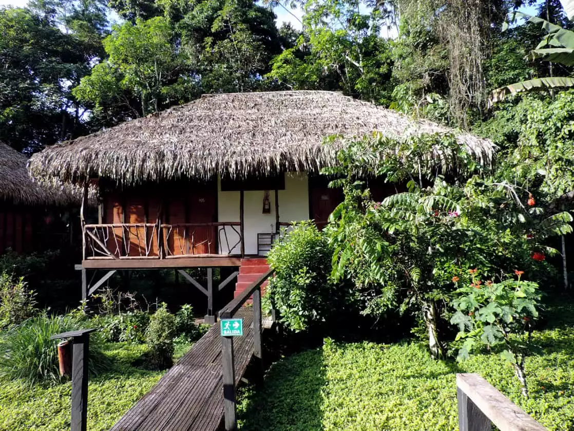 Sacha Lodge thatched roof hut nestled in the Amazon jungle.