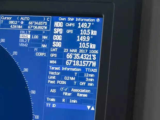 GPS on bridge showing the small ship expedition south of the Antarctic circle. 