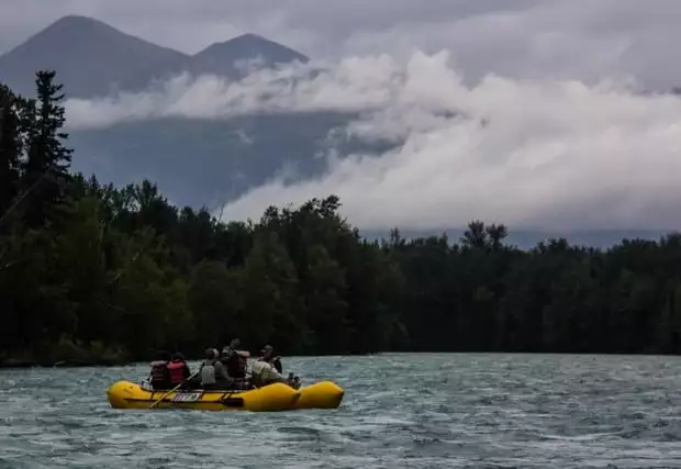 Guests from a small ship cruise in Alaska on a skiff excursion. 