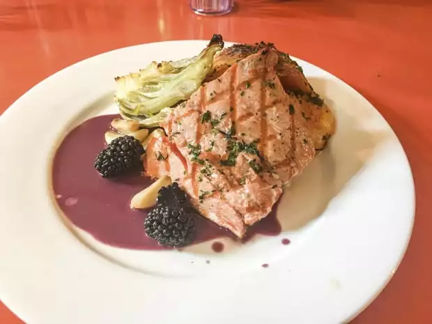 Fresh local salmon dinner served aboard Ursus small ship cruise in Alaska. 