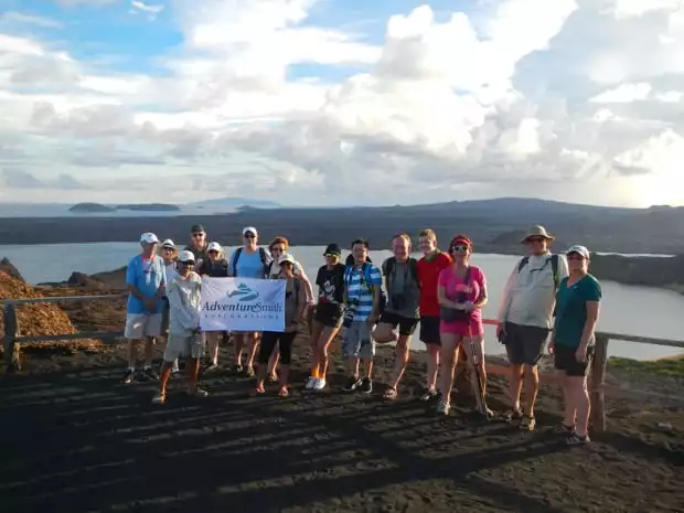 Group of Adventuresmith Explorations travelers on a view point in the Galapagos.